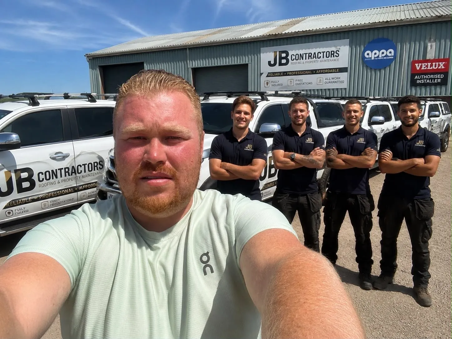 The Exeter Roofing team with their vans outside the yard